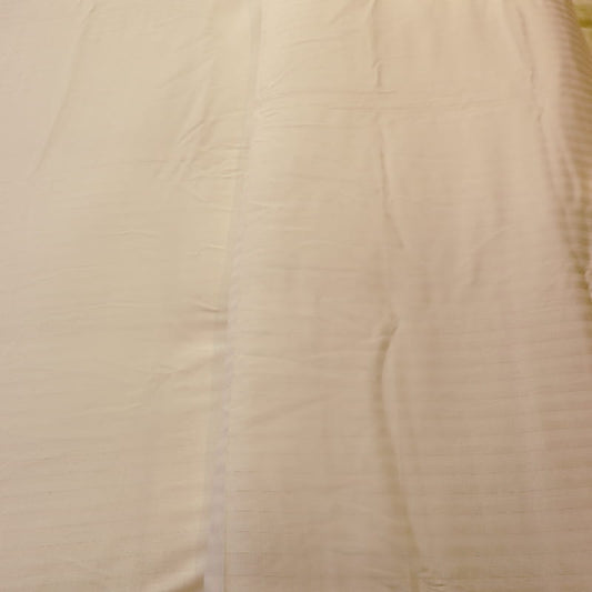 Close up of the Ivory Striped Egyptian Cotton Duvet Cover, a white king size duvet cover you can buy online at Sukham Home, a sustainable furniture, gardening and home decor store in Kolkata, India