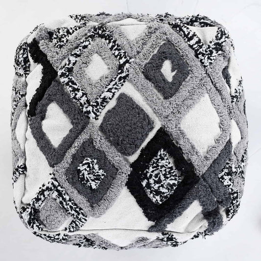 Against a white background, the Ivory White and Black Diamond Tufted Pouf, an ottoman made from cotton, available at Sukham Home, a sustainable furniture, kitchen & dining and home decor store in Kolkata, India