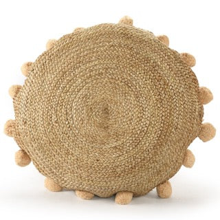 Against a white background, the Jute Round Floor Cushion, a circular braided accent pillow with pom poms, available at Sukham Home, a sustainable furniture, kitchen & dining and home decor store in Kolkata, India