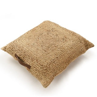 Tilted view of the Jute Square Floor Cushion, a square braided accent pillow, available at Sukham Home, a sustainable furniture, kitchen & dining and home decor store in Kolkata, India