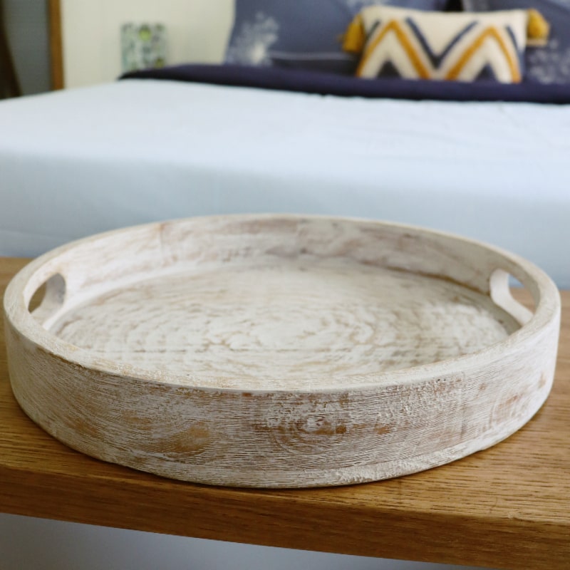 Close up of the rim of the Kutch White Wooden Tray, a solid wood patina white platter and serve ware you can buy online at Sukham Home, a sustainable furniture, kitchen & dining and home decor store in Kolkata, India