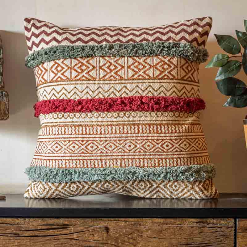 Arranged on a console table, the La La Land Cushion, a cotton handpainted and tufted accent pillow you can buy online at Sukham Home, a sustainable furniture, kitchen & dining and home decor store in Kolkata, India