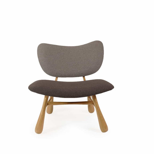 Against a white background, front view of the Leam Bow Armchair, a solid wood armchair with fabric you can buy online at Sukham Home, a sustainable furniture and home decor store in Kolkata, India