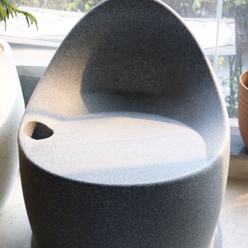 Front view of the Grey Stone Marvella Chair, a stone finish plastic outdoor furniture chair you can buy online at Sukham Home, a sustainable furniture, kitchen & dining and home decor store in Kolkata, India