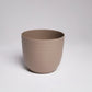 A single brown mocha Verona, a round colourful indoor planter made from plastic that you can buy online at Sukham Home, a sustainable furniture, gardening and home decor store in Kolkata, India