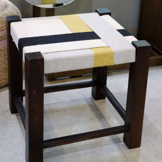 Side view of the Mondrian Jodhpur Stool, a cotton ottoman inspired by Mondrian colour blocking paintings, available at Sukham Home, a sustainable furniture, kitchen & dining and home decor store in Kolkata, India