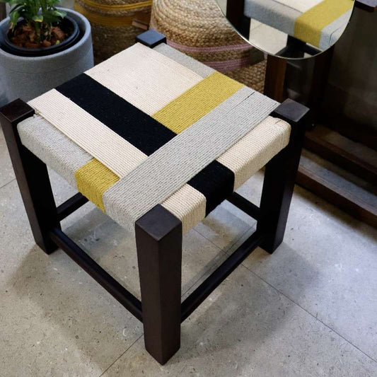 Top tilted view of the Mondrian Jodhpur Stool, a cotton ottoman inspired by Mondrian colour blocking paintings, available at Sukham Home, a sustainable furniture, kitchen & dining and home decor store in Kolkata, India