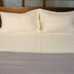 Full set of the Moon White Classic Solid Bedsheet, a cream king size and queen size cotton bedsheet you can buy online at Sukham Home, a sustainable furniture, gardening and home decor store in Kolkata, India