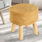 Placed on a carpet, Mustard Circle of Life Stool, a yellow ottoman made from jute, cotton and mango wood, available at Sukham Home, a sustainable furniture, kitchen & dining and home decor store in Kolkata, India