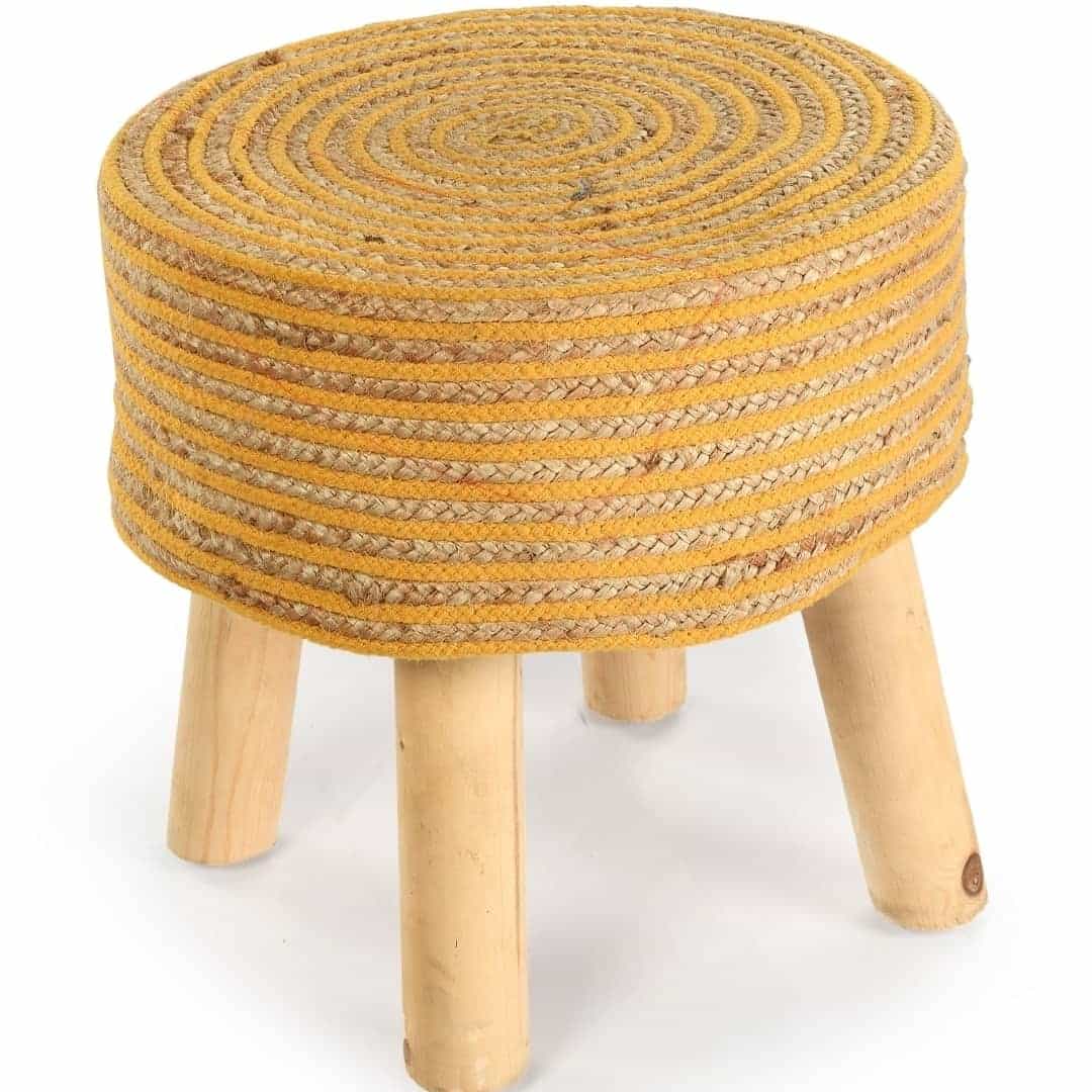 Against a white background, the Mustard Circle of Life Stool, a yellow ottoman made from jute, cotton and mango wood, available at Sukham Home, a sustainable furniture, kitchen & dining and home decor store in Kolkata, India