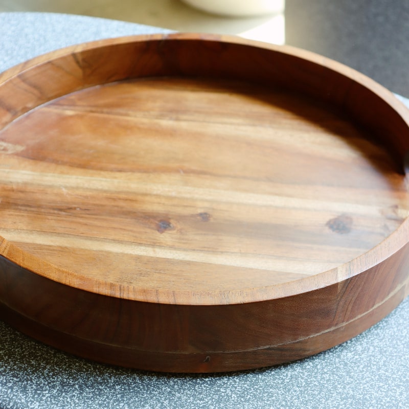 In the sunlight, the Natural Walnut Wooden Tray, a solid wood tray you can buy online at Sukham Home, a sustainable furniture, kitchen & dining and home decor store in Kolkata, India