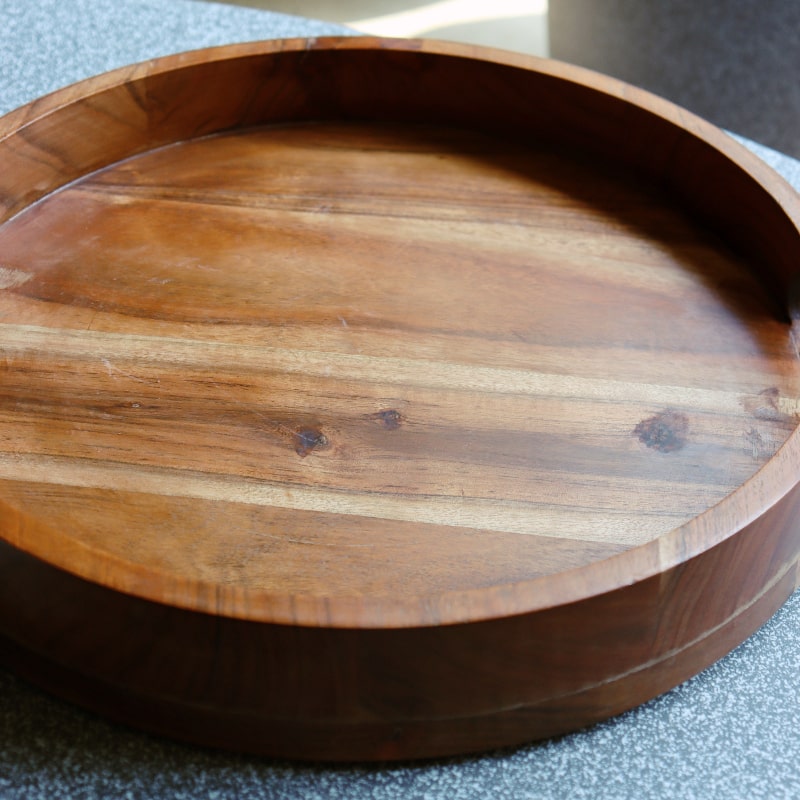 Close up of the rim of the Natural Walnut Wooden Tray, a solid wood tray you can buy online at Sukham Home, a sustainable furniture, kitchen & dining and home decor store in Kolkata, India