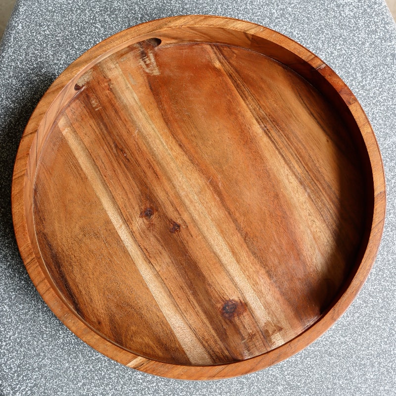 Against a grey background, Natural Walnut Wooden Tray, a solid wood tray you can buy online at Sukham Home, a sustainable furniture, kitchen & dining and home decor store in Kolkata, India