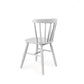 Against a white background, back view of the Oak White Perch Chair, a solid wood Windsor dining seat you can buy online at Sukham Home, a sustainable furniture and home decor store in Kolkata, India