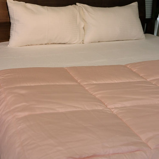 Whole set of the Pink Solid Comforter, a pink king size cotton bedsheet you can buy online at Sukham Home, a sustainable furniture, gardening and home decor store in Kolkata, India