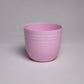 A single pink Verona, a round colourful indoor planter made from plastic that you can buy online at Sukham Home, a sustainable furniture, gardening and home decor store in Kolkata, India