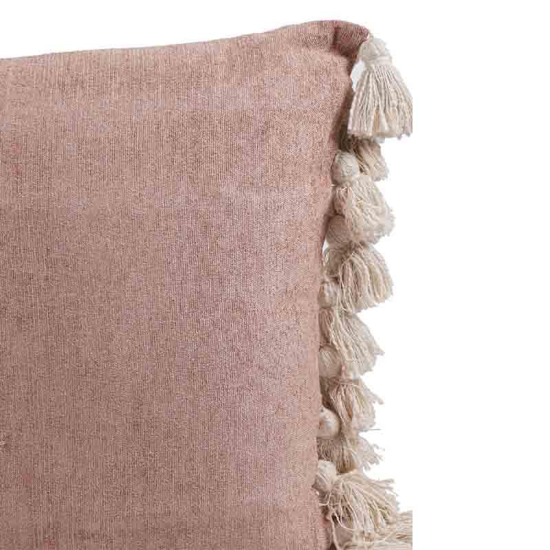 Close up of the texture and design of the Pinky Winky Cushions, a set of two pink velvet accent pillows with tassels you can buy online at Sukham Home, a sustainable furniture, kitchen & dining and home decor store in Kolkata, India