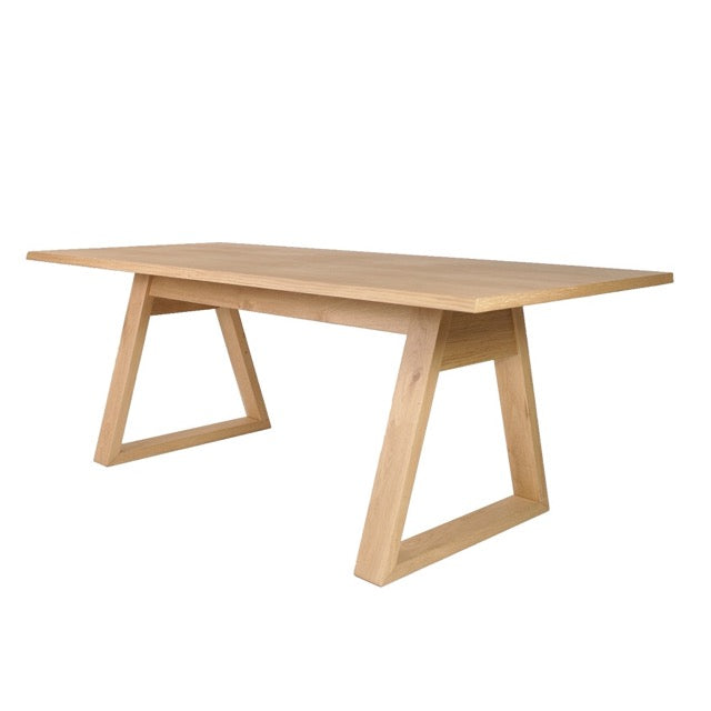 Against a white background, angled view of the Renuir, a wooden 6-seater rectangle dining table you can buy online at Sukham Home, a sustainable furniture, kitchen & dining and home decor store in Kolkata, India