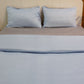 Both sky blue pillow cases and sky blue duvet side of the Navy Blue-Sky Blue Reversible Egyptian Cotton Duvet Cover, a dual king size duvet cover you can buy online at Sukham Home, a sustainable furniture, gardening and home decor store in Kolkata, India