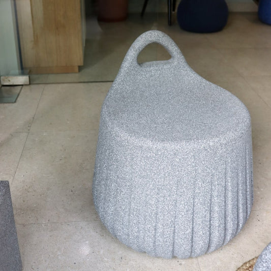 Side view of Grey Stone Rio Stool, a stone finish plastic outdoor furniture seat you can buy online at Sukham Home, a sustainable furniture, kitchen & dining and home decor store in Kolkata, India