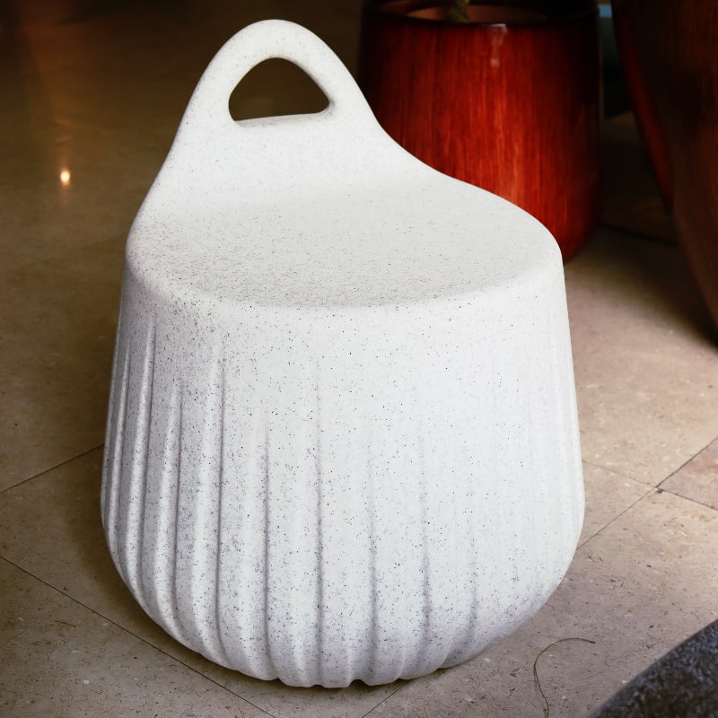 Side view of White Stone Rio Stool, a stone finish plastic outdoor furniture seat you can buy online at Sukham Home, a sustainable furniture, kitchen & dining and home decor store in Kolkata, India