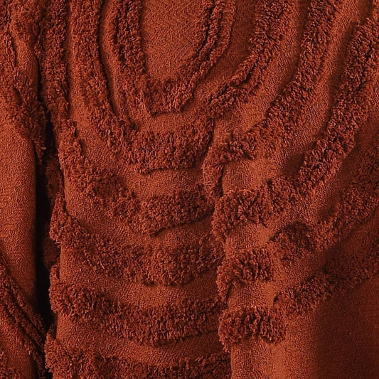 Close up of the tufted pattern and texture on the Rust Tufted Throw with Cushion Cover, a brick red throw and cover set you can buy online at Sukham Home, a sustainable furniture, kitchen & dining and home decor store in Kolkata, India