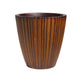 Against a white background, the Rustic Wood Rib Vertical XL, a wood finish textured luxury planter made from FRP you can buy online at Sukham Home, a sustainable furniture, gardening and home decor store in Kolkata, India