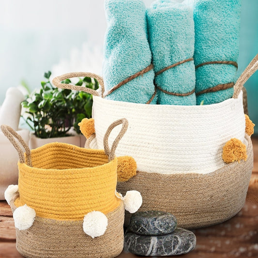 With products inside, the Playful Pom Pom Basket Set, a set of 2 yellow and white jute & cotton baskets you can buy online at Sukham Home, a sustainable furniture, kitchen & dining and home decor store in Kolkata, India