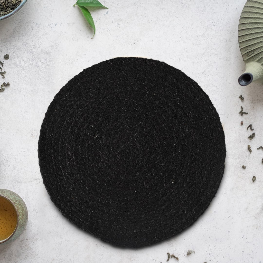 Top view of the Black Jute Placemat, a set of 2 or 4 round table mats you can buy online at Sukham Home, a sustainable furniture, kitchen & dining and home decor store in Kolkata, India