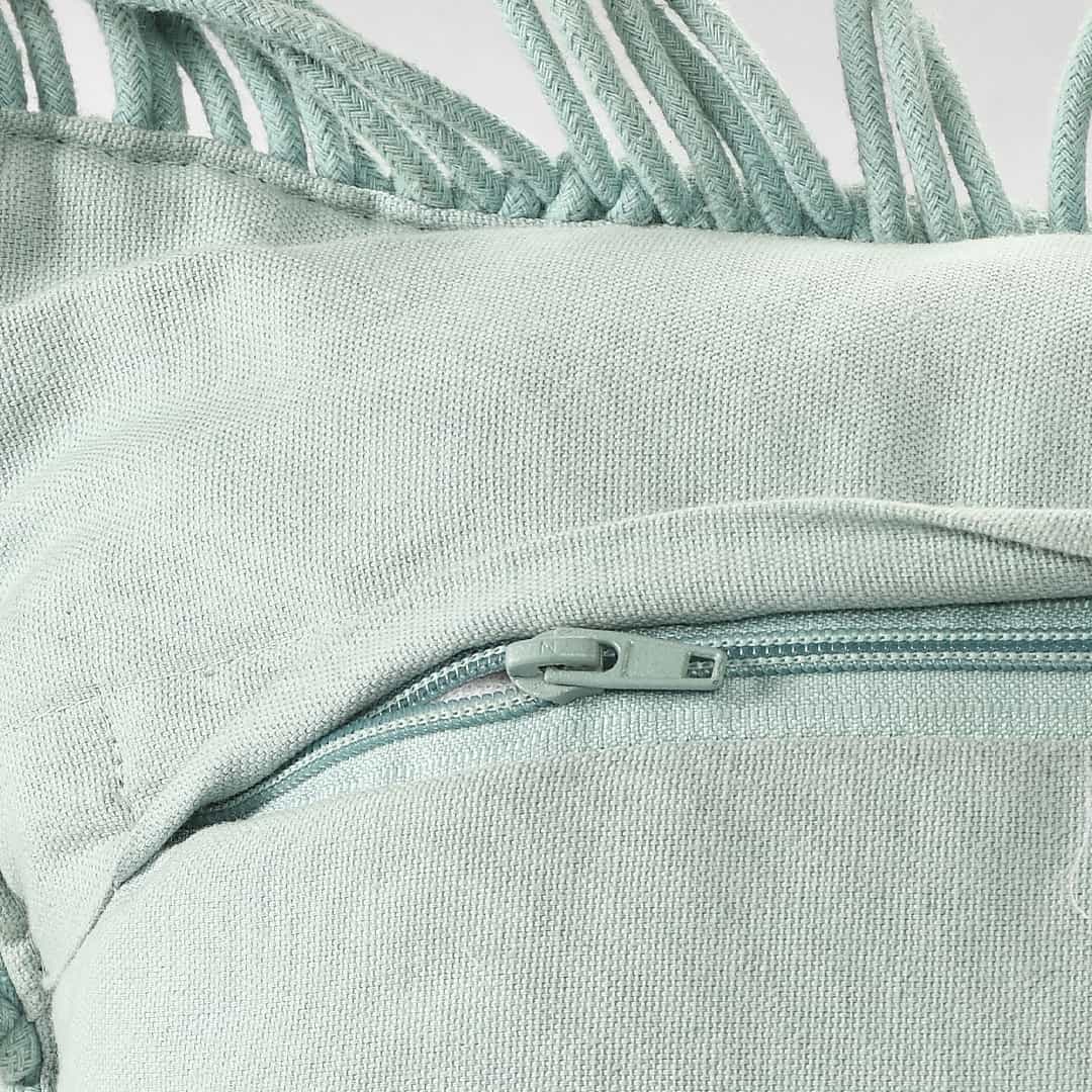 Close of the zip of the Sky Blue Macrame Cushion, a square accent pillow you can buy online at Sukham Home, a sustainable furniture, kitchen & dining and home decor store in Kolkata, India