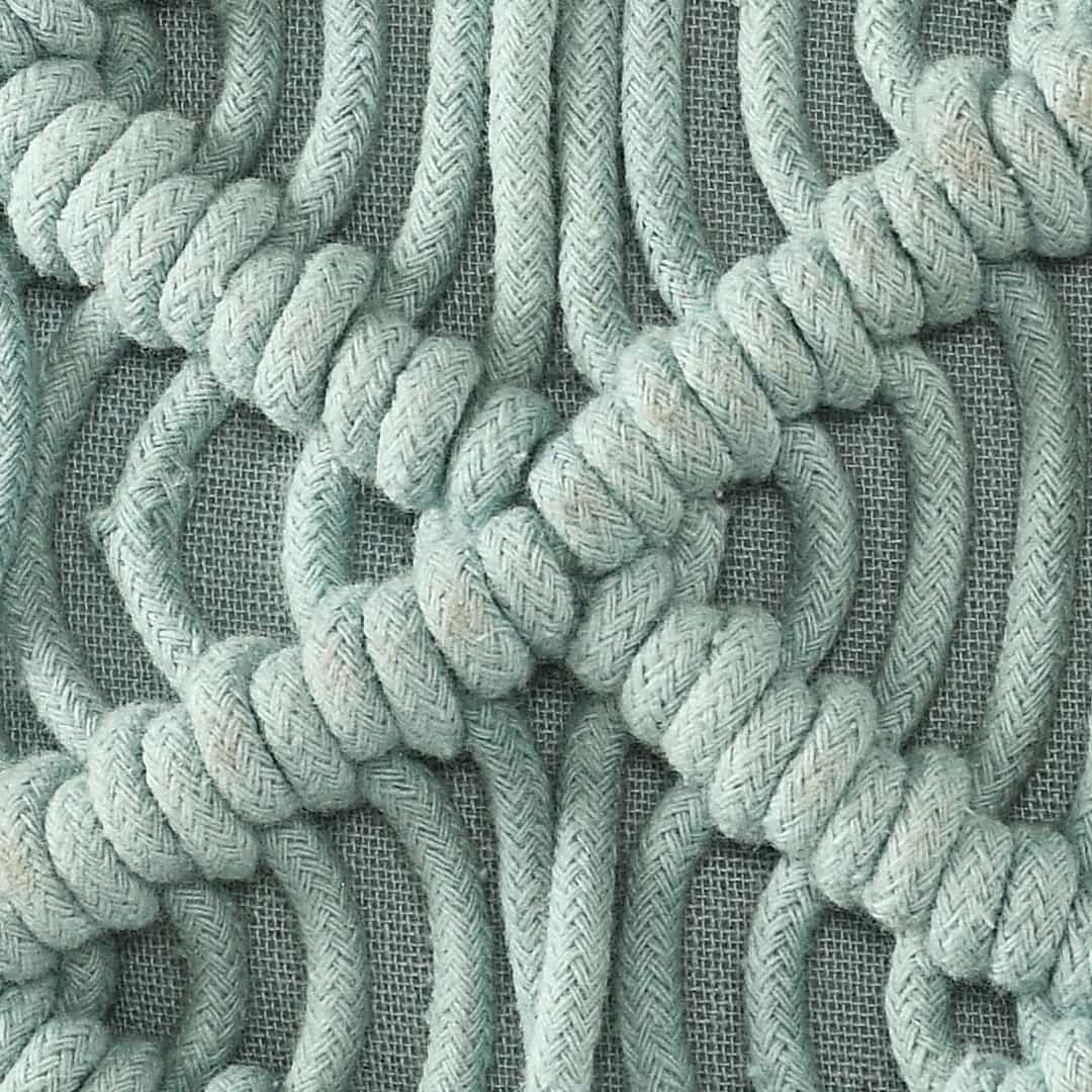 Close up of the design and texture of the Sky Blue Macrame Cushion, a square accent pillow you can buy online at Sukham Home, a sustainable furniture, kitchen & dining and home decor store in Kolkata, India