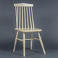 Against a grey background, the Oak Snow White String Chair, a solid wood Windsor dining seat you can buy online at Sukham Home, a sustainable furniture and home decor store in Kolkata, India