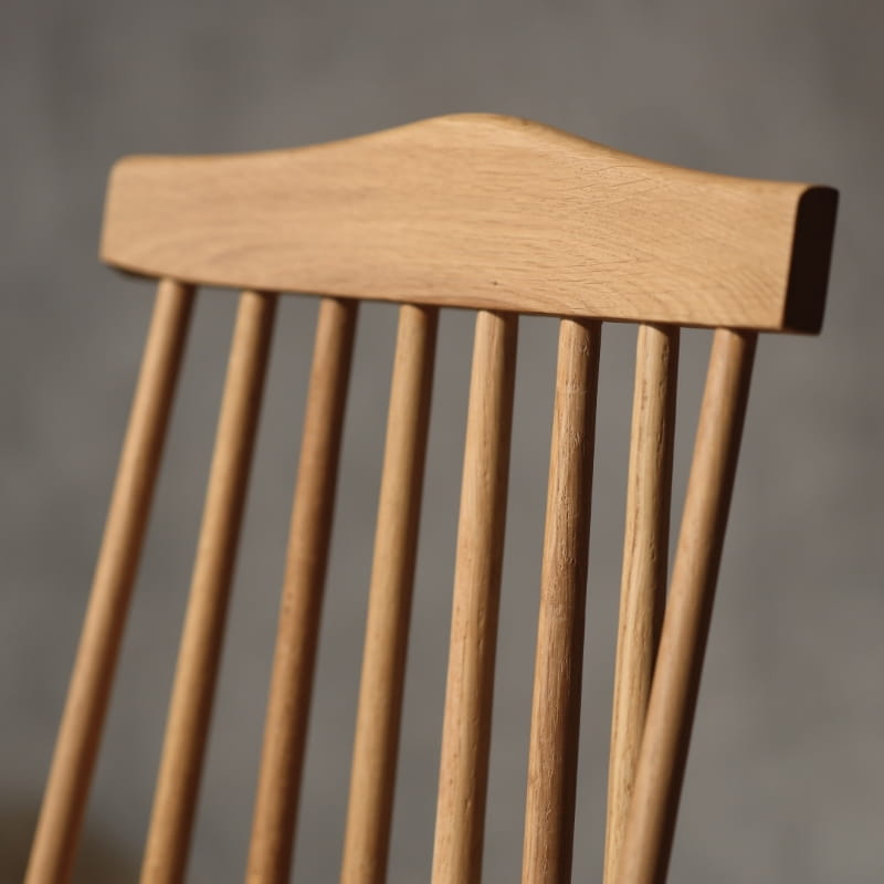 Back of the String Chair, a solid wood Windsor dining seat you can buy online at Sukham Home, a sustainable furniture and home decor store in Kolkata, India