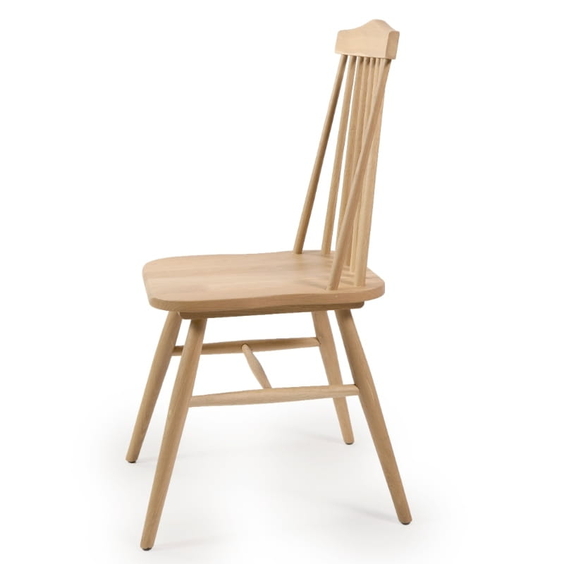 Against a white background, side view of the Oak Natural String Chair, a solid wood Windsor dining seat you can buy online at Sukham Home, a sustainable furniture and home decor store in Kolkata, India