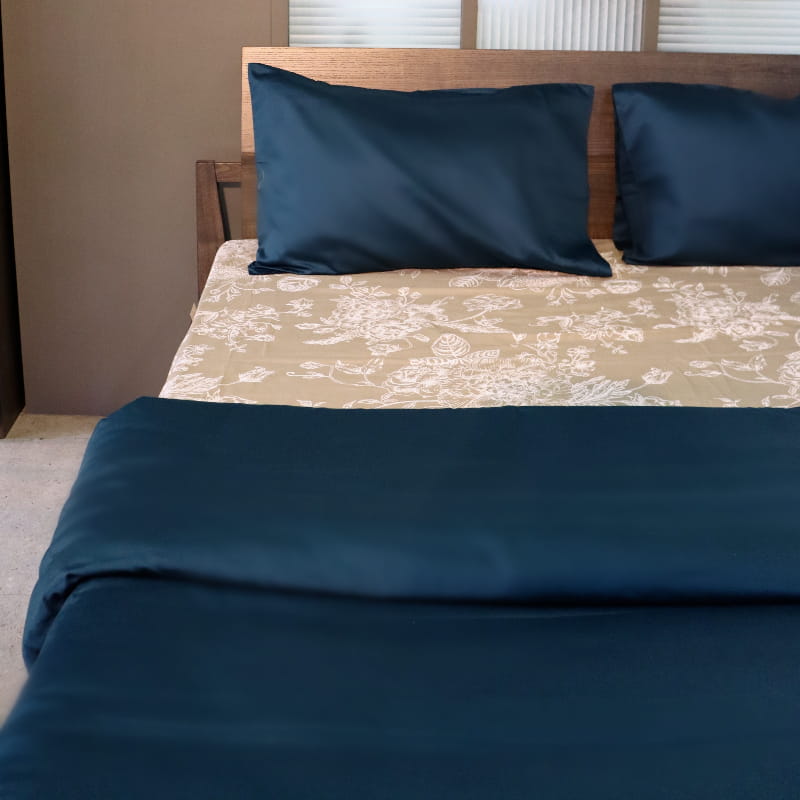 One pillow cover and duvet of the Teal Solid Egyptian Cotton Duvet Cover, a plain green king size duvet cover you can buy online at Sukham Home, a sustainable furniture, gardening and home decor store in Kolkata, India