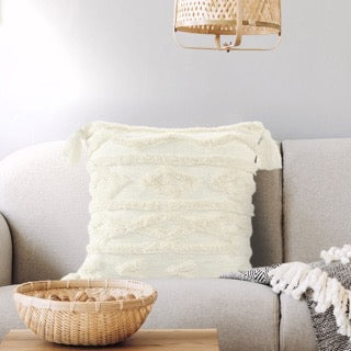 Placed on a sofa with a throw, the White Diamond Tufted Cushion, a square ivory accent pillow available at Sukham Home, a sustainable furniture, kitchen & dining and home decor store in Kolkata, India