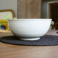 Side view of the Ivory Ganga Serving Bowl, a white and 24-karat gold ceramic serving big bowl you can buy online at Sukham Home, a sustainable furniture, gardening and home decor store in Kolkata, India