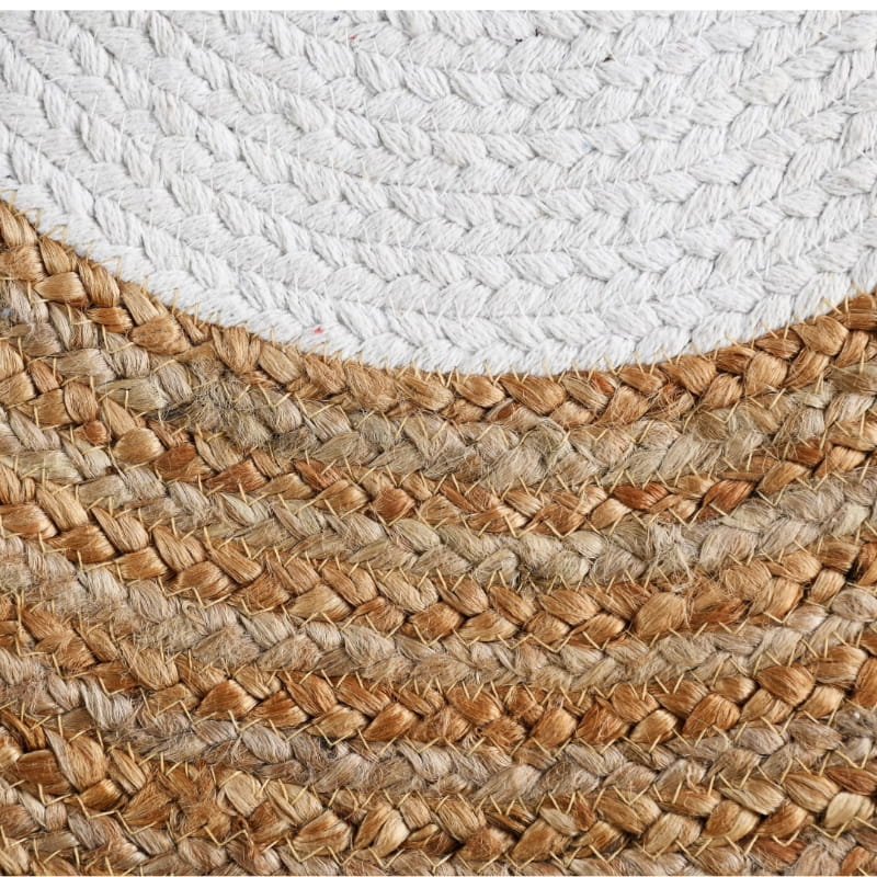 Close up of the weaving pattern on the Braided Round Jute Rug with White Border, a circular jute and white cotton carpet you can buy online at Sukham Home, a sustainable furniture, kitchen & dining and home decor store in Kolkata, India