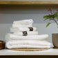 Whole set of White Silly-Cuddly, a set of 8 white floral towels you can buy online at Sukham Home, a sustainable furniture, kitchen & dining and home decor store in Kolkata, India