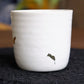 Close up of the Ivory Ganga Kulhad, an pure white and 24-karat gold ceramic cup/glass you can buy online at Sukham Home, a sustainable furniture, gardening and home decor store in Kolkata, India