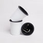 Two stacked together, the Oslo, a round white, self watering indoor planter made from plastic that you can buy online at Sukham Home, a sustainable furniture, gardening and home decor store in Kolkata, India