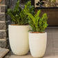 In White Stone finish, both sizes of the Rib Elegant, a round tall textured luxury planter made from FRP you can buy online at Sukham Home, a sustainable furniture, gardening and home decor store in Kolkata, India
