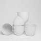 Five pieces of white Verona, a round colourful indoor planter made from plastic that you can buy online at Sukham Home, a sustainable furniture, gardening and home decor store in Kolkata, India