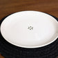Rim of the Ivory Ganga Dinner Plate, a pure white and 24-karat gold ceramic plate you can buy online at Sukham Home, a sustainable furniture, gardening and home decor store in Kolkata, India