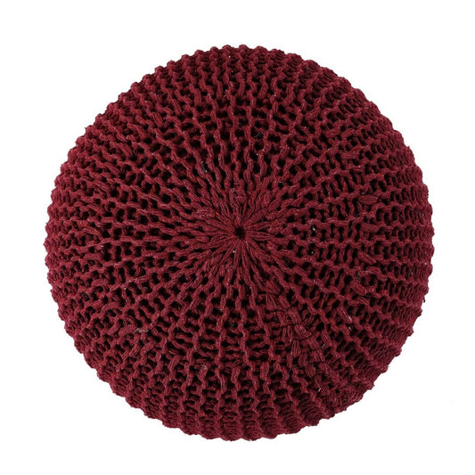 Against a white background, top view of the Wine Knitted Pouf, a red magenta ottoman made from cotton, available at Sukham Home, a sustainable furniture, kitchen & dining and home decor store in Kolkata, India