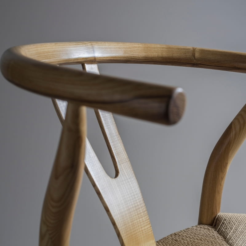 Back of the Wishbone Chair, a solid wood rattan dining seat you can buy online at Sukham Home, a sustainable furniture and home decor store in Kolkata, India