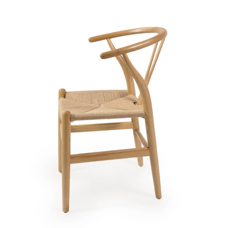 Against a white background, side view of the Oak Natural Wishbone Chair, a solid wood rattan dining seat you can buy online at Sukham Home, a sustainable furniture and home decor store in Kolkata, India