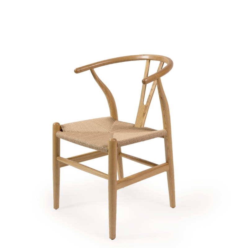 Against a white background, the Oak Natural Wishbone Chair, a solid wood rattan dining seat you can buy online at Sukham Home, a sustainable furniture and home decor store in Kolkata, India