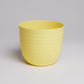 Single piece of yellow Verona, a round colourful indoor planter made from plastic that you can buy online at Sukham Home, a sustainable furniture, gardening and home decor store in Kolkata, India