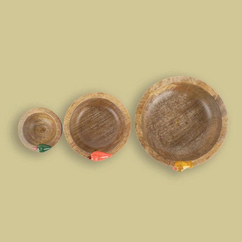 Top view of the Birds in Paradise Wooden Bowls, a set of 3 solid wood bowls with sculptures you can buy online at Sukham Home, a sustainable furniture, kitchen & dining and home decor store in Kolkata, India